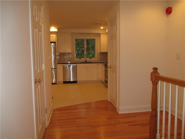 29 Carpenter Ave Unit B3, Mount Kisco, NY 10549 - corridor with light wood finished floors, a sink, and baseboards