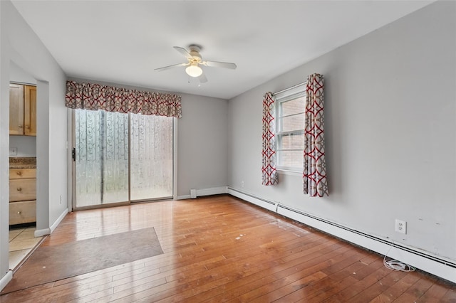 1668 Rte 9 Unit 10D, Wappingers Falls, NY 12590 - empty room with ceiling fan, light wood-style floors, baseboard heating, and baseboards