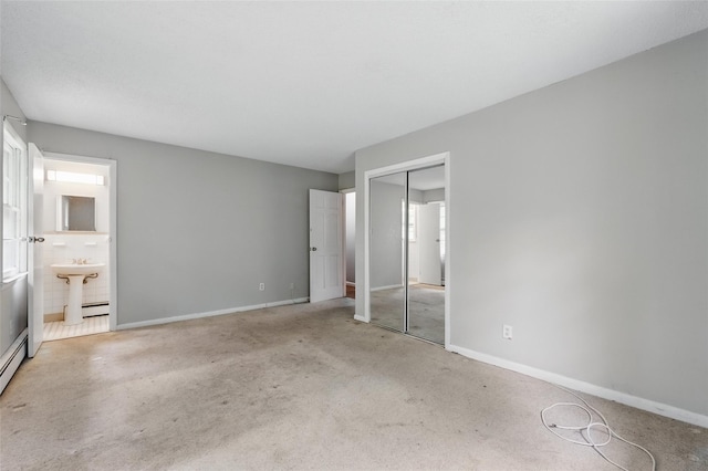 1668 Rte 9 Unit 10D, Wappingers Falls, NY 12590 - unfurnished bedroom featuring carpet floors, baseboards, a closet, and ensuite bathroom