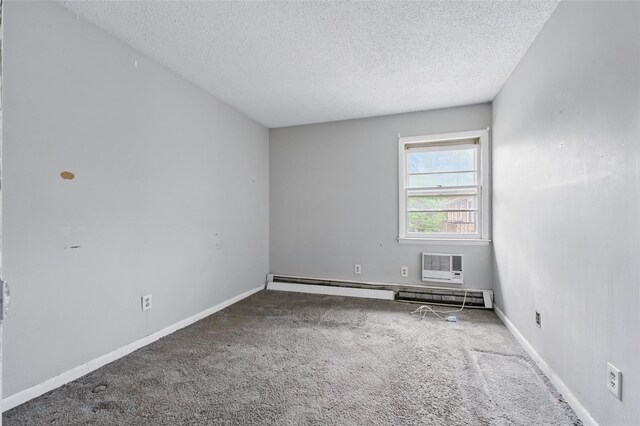 1668 Rte 9 Unit 10D, Wappingers Falls, NY 12590 - carpeted spare room with a textured ceiling, baseboards, and a wall unit AC