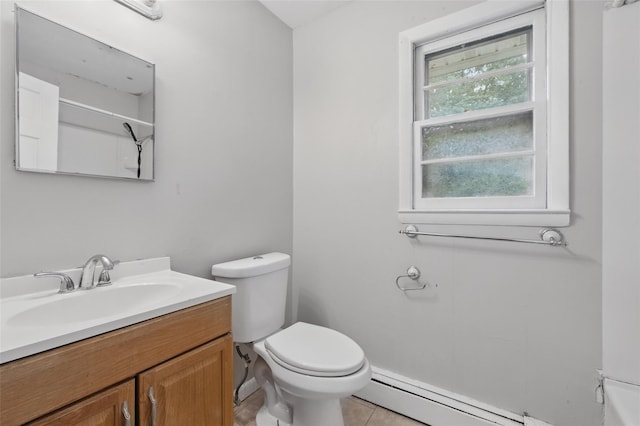 1668 Rte 9 Unit 10D, Wappingers Falls, NY 12590 - bathroom featuring a baseboard radiator, toilet, vanity, and tile patterned floors