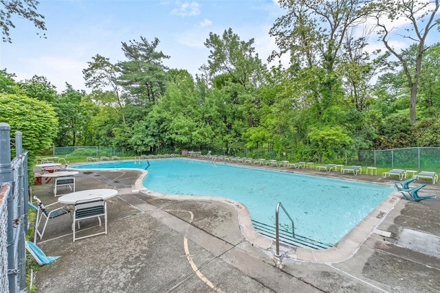 1668 Rte 9 Unit 10D, Wappingers Falls, NY 12590 - community pool featuring view of wooded area and a patio area