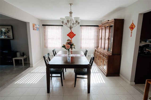 1114 Arden Ave, Staten Island, NY 10312 - dining area featuring a chandelier, baseboards, and light tile patterned floors