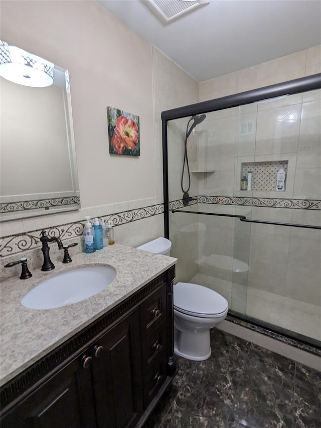 1114 Arden Ave, Staten Island, NY 10312 - bathroom featuring vanity, toilet, a shower stall, and marble finish flooring