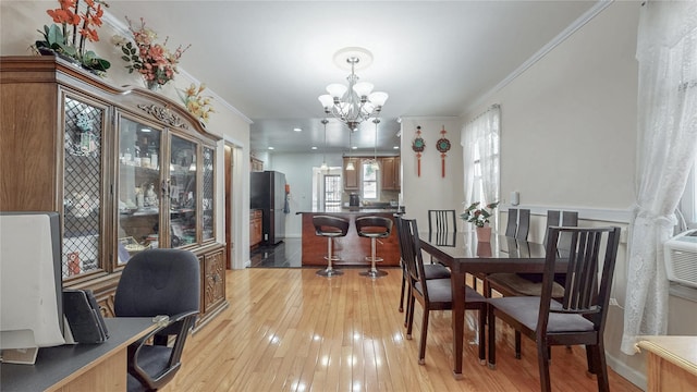 68-37 Kessel St, Forest Hills, NY 11375 - dining area featuring ornamental molding, a chandelier, light wood finished floors, and an office area