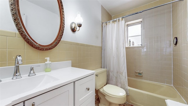 68-37 Kessel St, Forest Hills, NY 11375 - bathroom featuring tile walls, vanity, toilet, shower / tub combo, and wainscoting