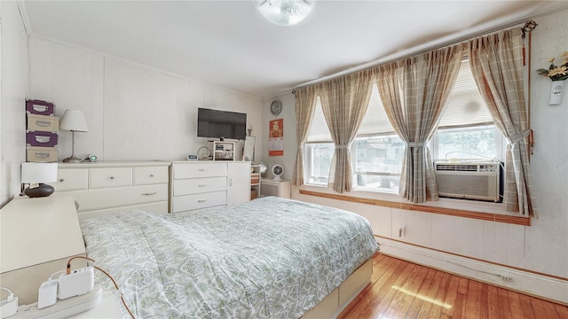 68-37 Kessel St, Forest Hills, NY 11375 - bedroom with light wood-type flooring, ornamental molding, and cooling unit
