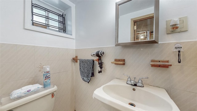 68-37 Kessel St, Forest Hills, NY 11375 - half bathroom with tile walls, a sink, and toilet