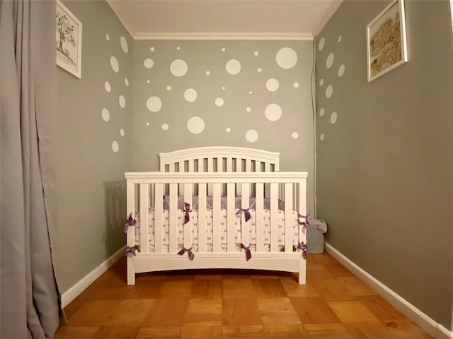 70-25 Yellow Stone Blvd Unit 10Z, Forest Hills, NY 11375 - bedroom featuring ornamental molding, a crib, and baseboards