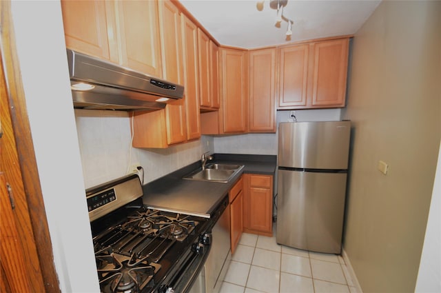 70-25 Yellow Stone Blvd Unit 10Z, Forest Hills, NY 11375 - kitchen featuring appliances with stainless steel finishes, under cabinet range hood, dark countertops, light tile patterned floors, and light brown cabinetry