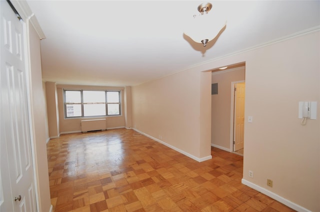 70-25 Yellow Stone Blvd Unit 10Z, Forest Hills, NY 11375 - spare room featuring crown molding and radiator