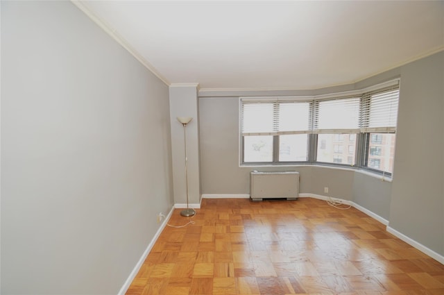 70-25 Yellow Stone Blvd Unit 10Z, Forest Hills, NY 11375 - unfurnished room featuring radiator and crown molding