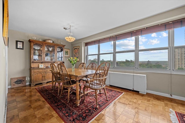 555 Kappock St Unit 17D, Bronx, NY 10463 - dining room with a chandelier and baseboards