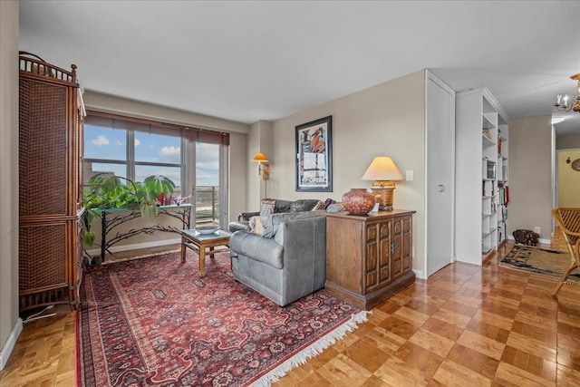 555 Kappock St Unit 17D, Bronx, NY 10463 - living area featuring baseboards and a chandelier