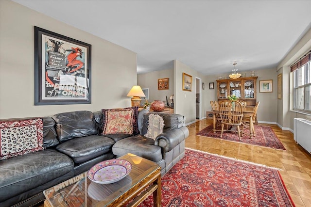 555 Kappock St Unit 17D, Bronx, NY 10463 - living area featuring baseboards and a chandelier