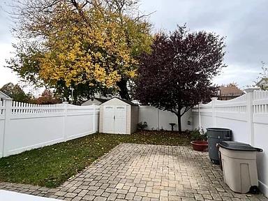 133-50 123rd St Unit 2, South Ozone Park, NY 11420 - fenced backyard featuring a patio