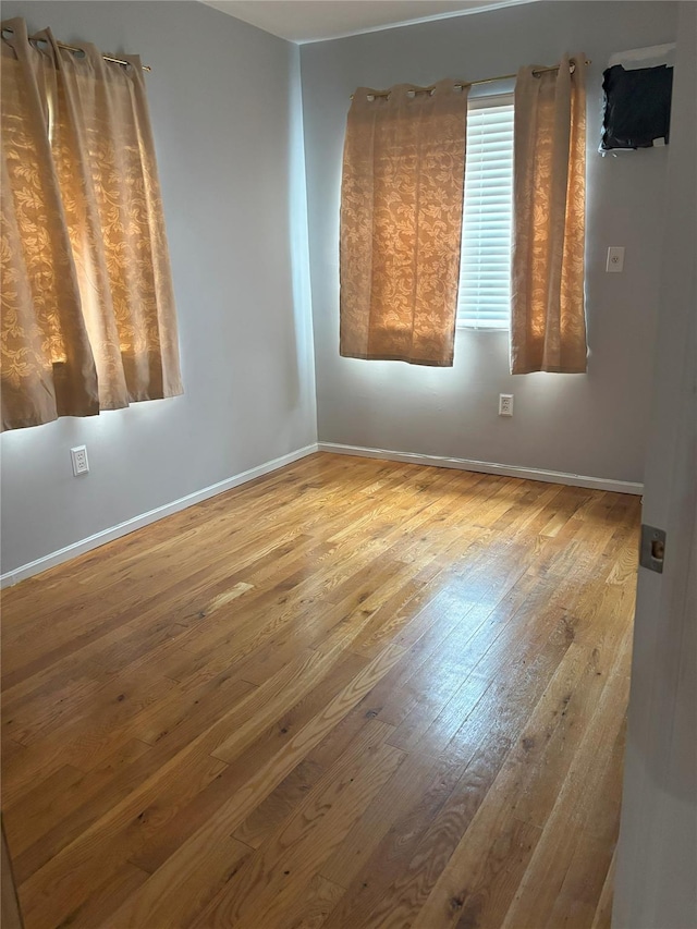 133-50 123rd St Unit 2, South Ozone Park, NY 11420 - spare room featuring hardwood / wood-style flooring and baseboards