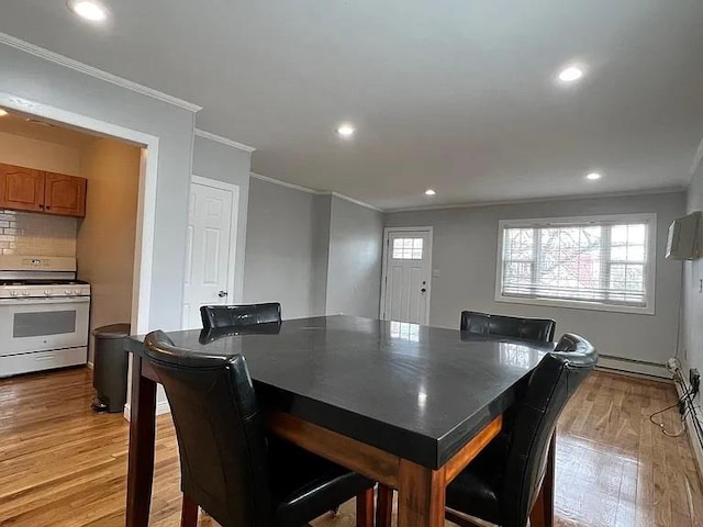 133-50 123rd St Unit 2, South Ozone Park, NY 11420 - dining area with crown molding, light wood-style flooring, a baseboard radiator, and recessed lighting