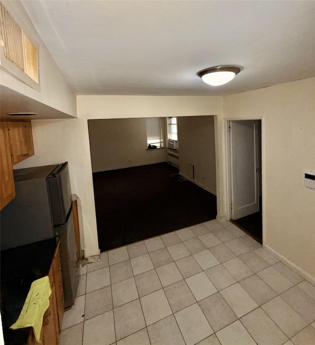105-24 64 Unit 4L, Forest Hills, NY 11375 - empty room with light tile patterned flooring and baseboards