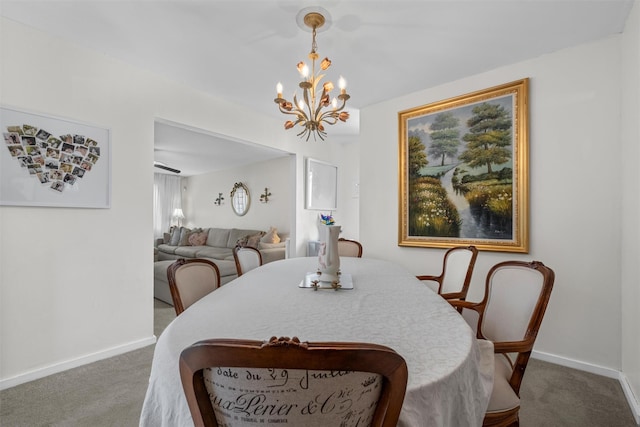 2B Kings Unit 2B, Mohegan Lake, NY 10547 - carpeted dining area featuring a chandelier and baseboards