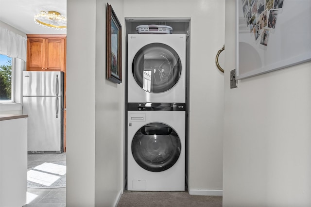 2B Kings Unit 2B, Mohegan Lake, NY 10547 - laundry room featuring stacked washer / drying machine and carpet