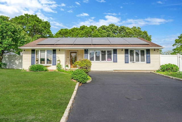 25 Biscayne Dr, Selden, NY 11784 - single story home featuring roof mounted solar panels and asphalt driveway