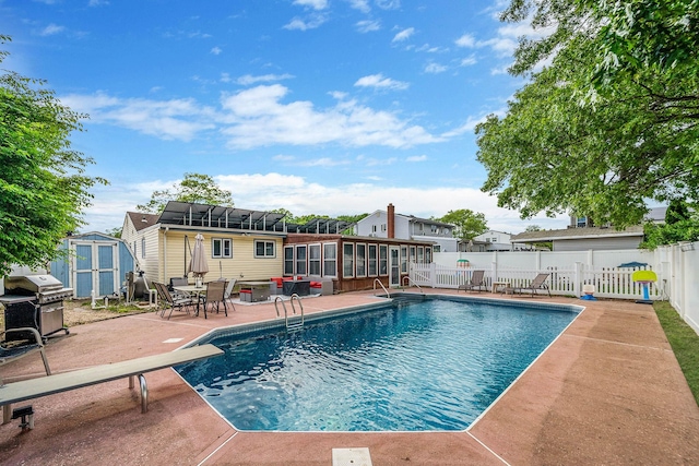 25 Biscayne Dr, Selden, NY 11784 - view of swimming pool featuring a patio, area for grilling, a sunroom, a residential view, and a diving board