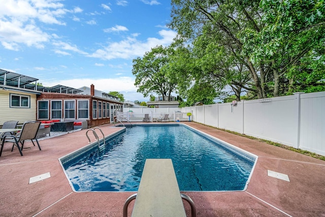 25 Biscayne Dr, Selden, NY 11784 - view of swimming pool with a patio area, a fenced backyard, and a diving board