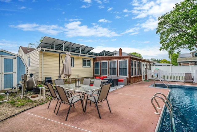 25 Biscayne Dr, Selden, NY 11784 - back of property featuring a patio, a sunroom, a chimney, and outdoor dining area