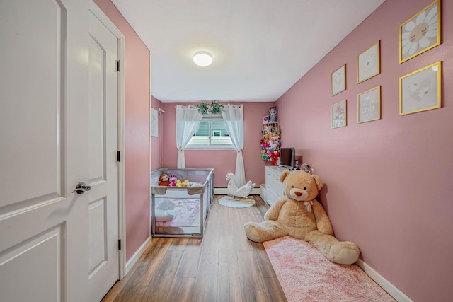 25 Biscayne Dr, Selden, NY 11784 - bedroom featuring wood finished floors and baseboards