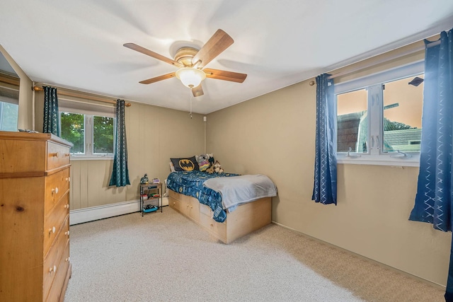25 Biscayne Dr, Selden, NY 11784 - bedroom with baseboard heating, carpet, and a ceiling fan