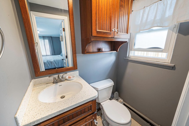 25 Biscayne Dr, Selden, NY 11784 - bathroom with vanity, toilet, ensuite bath, and baseboard heating