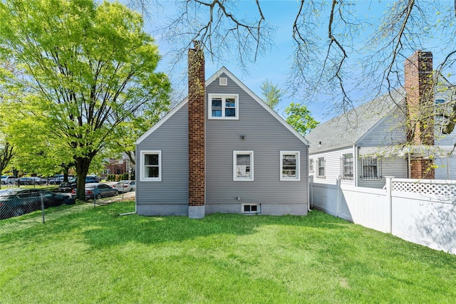 183-19 145th Ave, Springfield Gardens, NY 11413 - rear view of property featuring a chimney