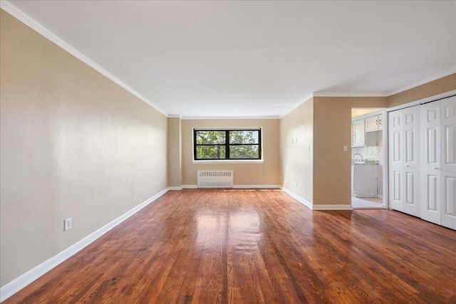 2545 Sedgwick Ave Unit 3B, Bronx, NY 10463 - unfurnished living room featuring radiator heating unit, wood finished floors, ornamental molding, and baseboards