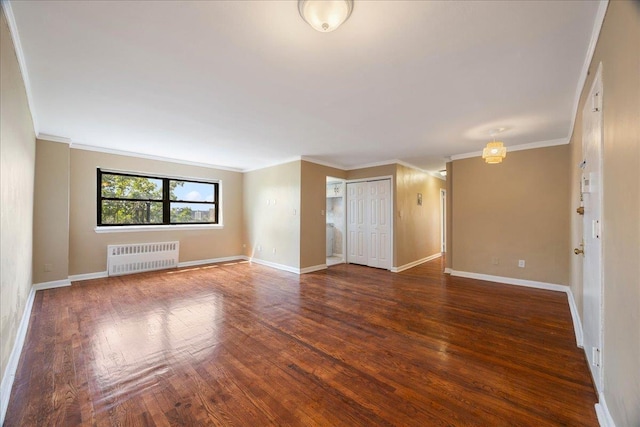 2545 Sedgwick Ave Unit 3B, Bronx, NY 10463 - empty room with radiator heating unit, crown molding, wood finished floors, and baseboards