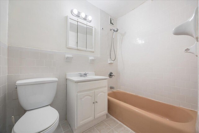 2545 Sedgwick Ave Unit 3B, Bronx, NY 10463 - bathroom with vanity, toilet,  shower combination, tile walls, and tile patterned floors
