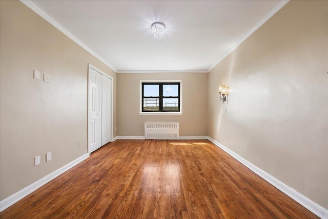 2545 Sedgwick Ave Unit 3B, Bronx, NY 10463 - unfurnished bedroom with radiator, wood finished floors, baseboards, ornamental molding, and a closet