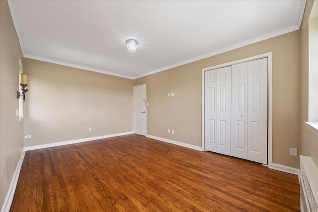 2545 Sedgwick Ave Unit 3B, Bronx, NY 10463 - unfurnished bedroom featuring wood finished floors, crown molding, baseboards, and a closet
