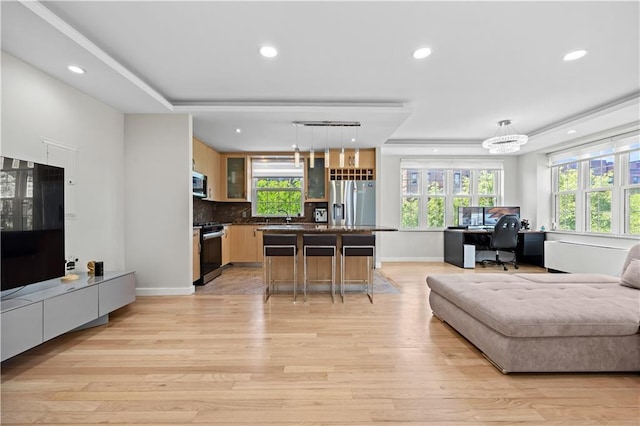 150 Oceana Dr W Unit 4B, Brooklyn, NY 11235 - living room with light wood-style floors, an office area, recessed lighting, a raised ceiling, and baseboards