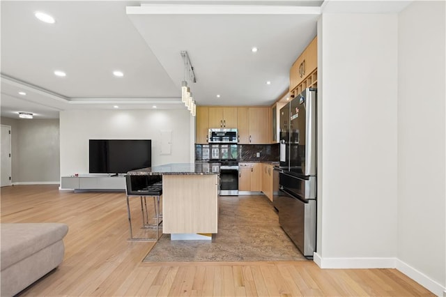 150 Oceana Dr W Unit 4B, Brooklyn, NY 11235 - kitchen with stainless steel appliances, open floor plan, light brown cabinets, light wood finished floors, and recessed lighting