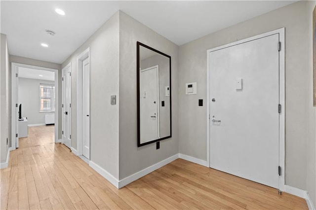 150 Oceana Dr W Unit 4B, Brooklyn, NY 11235 - foyer entrance with light wood finished floors, baseboards, and recessed lighting