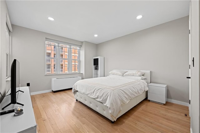 150 Oceana Dr W Unit 4B, Brooklyn, NY 11235 - bedroom with radiator, baseboards, light wood-style flooring, and recessed lighting