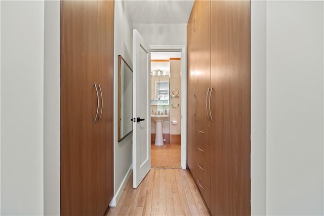 150 Oceana Dr W Unit 4B, Brooklyn, NY 11235 - corridor with light wood-style flooring and a sink