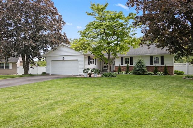 18 Chivalry Ln, Nesconset, NY 11767 - view of front of home featuring driveway, a garage, and brick siding