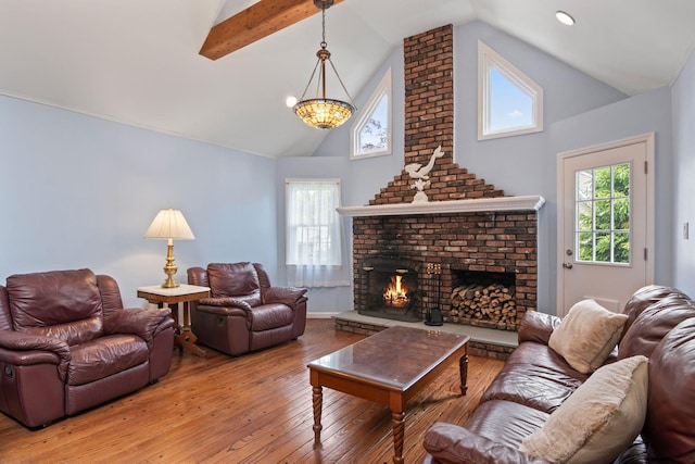 18 Chivalry Ln, Nesconset, NY 11767 - living room featuring hardwood / wood-style floors, a fireplace, high vaulted ceiling, a chandelier, and recessed lighting