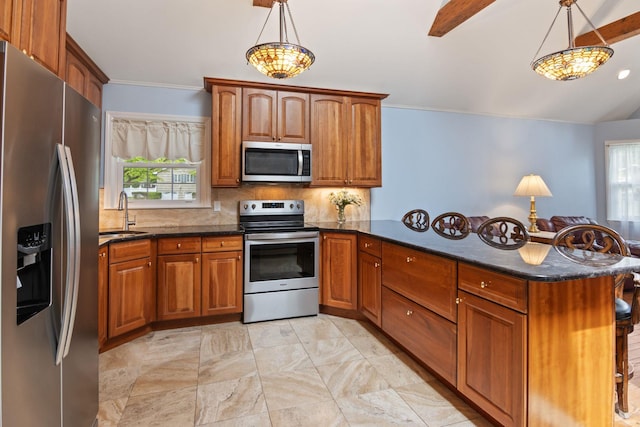 18 Chivalry Ln, Nesconset, NY 11767 - kitchen featuring stainless steel appliances, a peninsula, a sink, brown cabinetry, and decorative backsplash