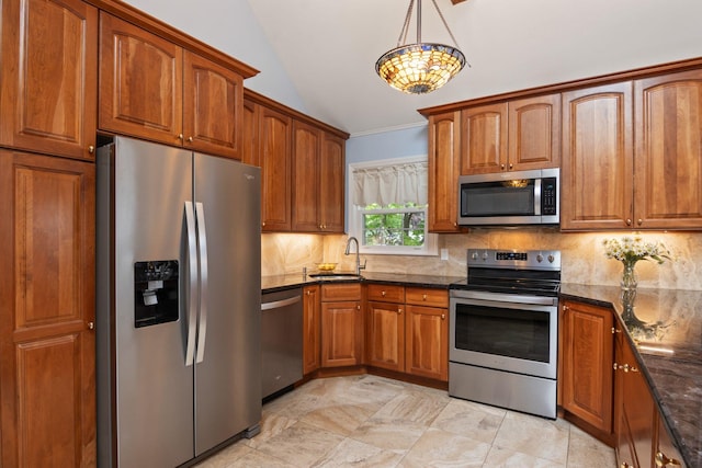 18 Chivalry Ln, Nesconset, NY 11767 - kitchen featuring appliances with stainless steel finishes, a sink, lofted ceiling, brown cabinets, and tasteful backsplash
