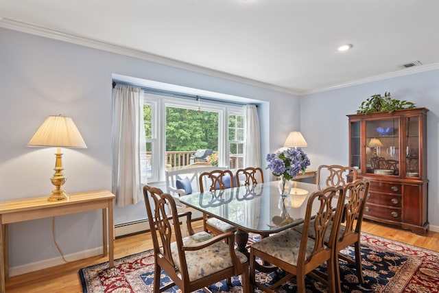 18 Chivalry Ln, Nesconset, NY 11767 - dining space with ornamental molding, light wood-type flooring, a baseboard heating unit, baseboards, and recessed lighting