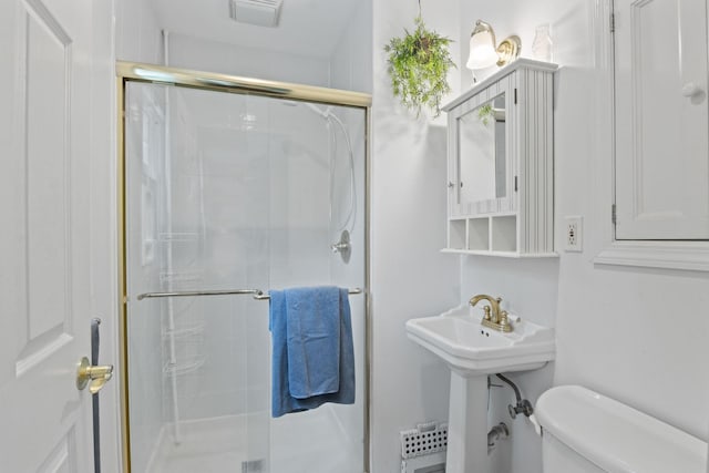 18 Chivalry Ln, Nesconset, NY 11767 - bathroom with toilet, a shower stall, and a sink