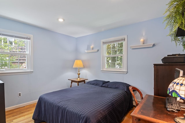 18 Chivalry Ln, Nesconset, NY 11767 - bedroom featuring multiple windows, wood finished floors, baseboards, and recessed lighting